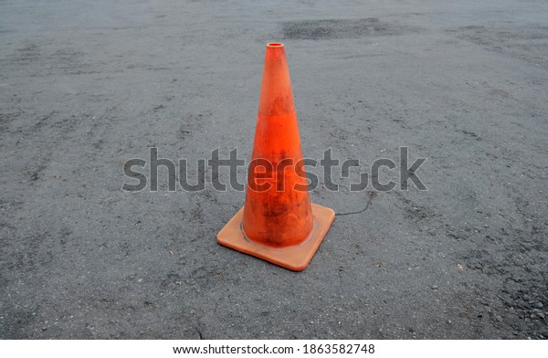 Isolated orange cone.\
Traffic Cone On Street