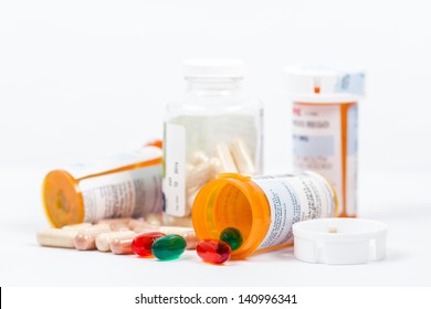 Isolated Orange Prescription Medication Bottles With Pills