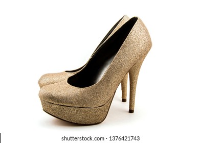 An Isolated Pair Of Gold Stiletto Heals