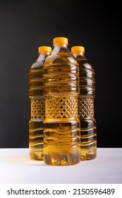 Isolated  Palm Oil In Plastic Bottle With Black Background