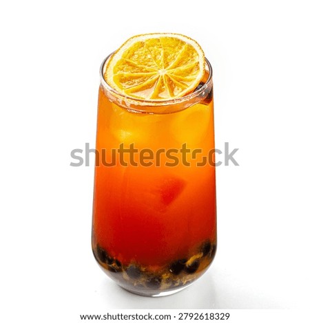 Isolated passion fruit bubble tea with tapioca pearls ice and dried citrus garnish on white background