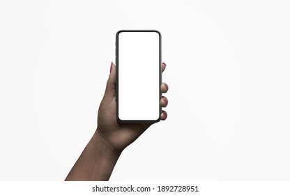 Isolated phone in hand with low, night light. Dark skin. Isolated display for app design promotion - Shutterstock ID 1892728951