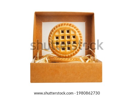 Isolated photo of carboard box with cookie on white background.