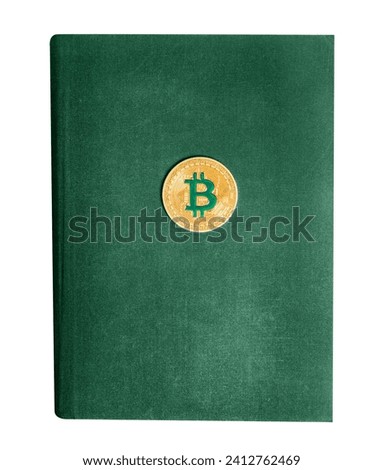 Isolated photo of green colored old book with bitcoin coin on white background.