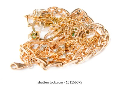 Isolated Pile Of Gold Jewelry On White Background (chains, Necklaces, Bracelets, Earrings, Rings And Other Scrap Gold).