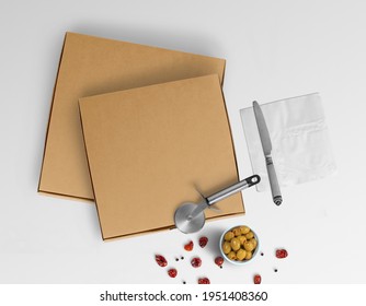 Isolated Plain Kraft Paper Two Pizza Boxes With Cutter Knife Napkin And Olives