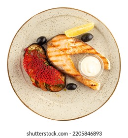 Isolated Plate Of Gourmet Grilled Salmon Steak With Aubergine