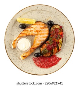 Isolated Plate Of Gourmet Grilled Salmon Steak With Aubergine