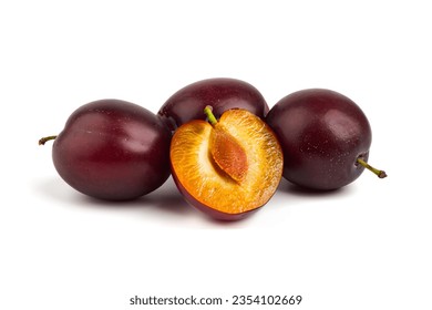 Isolated plums. One and a half of blue plum fruit, isolated on white background