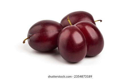 Isolated plums. One and a half of blue plum fruit with leaves isolated on white background