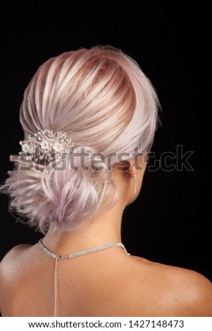 Isolated portrait of beautiful woman with modern coiffure. Stylish hairdo