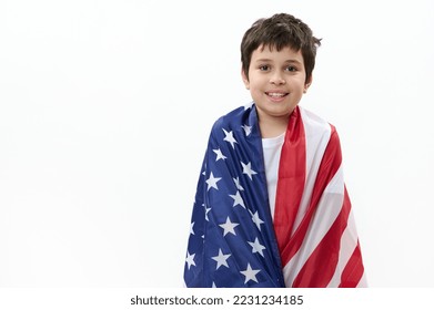 Isolated portrait on white background of a happy American teenage boy with USA flag. Citizenship, immigration, emigration, winning the green card lottery and freedom concept. Independence Day July 4 - Shutterstock ID 2231234185
