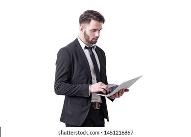 Isolated Portrait Of Serious Young Businessman With Beard Working With Laptop Computer. Concept Of Hi Tech.