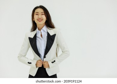 Isolated Portrait Studio Shot Of Asian Happy Confident Professional Arrogant Female Businesswoman In Business Formal Suit Standing Smiling Posing Crossed Arms Look At Camera On White Background.