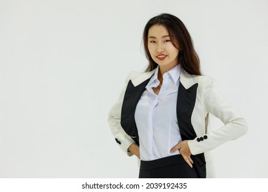 Isolated Portrait Studio Shot Of Asian Happy Confident Professional Arrogant Female Businesswoman In Business Formal Suit Standing Smiling Posing Crossed Arms Look At Camera On White Background.