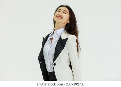 Isolated Portrait Studio Shot Of Asian Happy Confident Professional Arrogant Female Businesswoman In Business Formal Suit Standing Smiling Posing Crossed Arms Look At Camera On White Background.