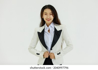 Isolated Portrait Studio Shot Of Asian Happy Confident Professional Arrogant Female Businesswoman In Business Formal Suit Standing Smiling Posing Crossed Arms Look At Camera On White Background.