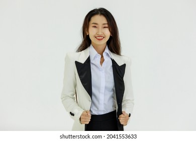 Isolated Portrait Studio Shot Of Asian Happy Confident Professional Arrogant Female Businesswoman In Business Formal Suit Standing Smiling Posing Crossed Arms Look At Camera On White Background.