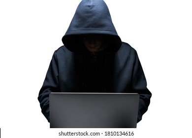 Isolated portrait of young hacker using laptop. Concept of cybersecurity and data protection