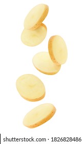 Isolated potato pieces in the air. Unpeeled slices of raw washed potato falling down over white background