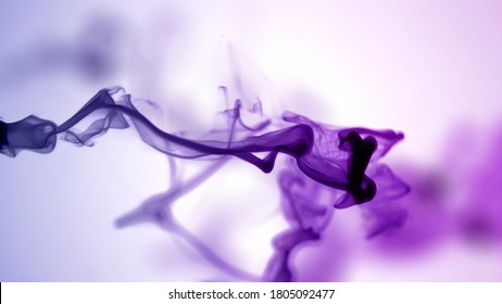 Isolated Purple Violet Ink Cloud floating in clear water. Shot on White Background with selective focus. - Powered by Shutterstock