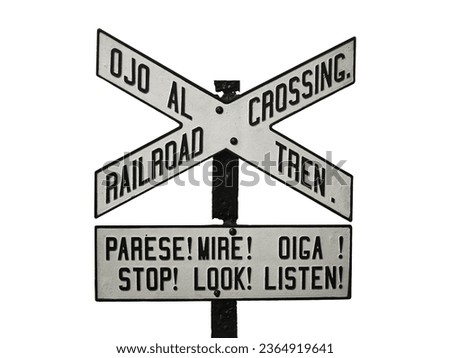 Isolated Railroad Crossing Sign in English and Spanish language with White Background