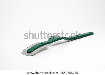 Isolated razor with handle for bread scoring and bread making over white background