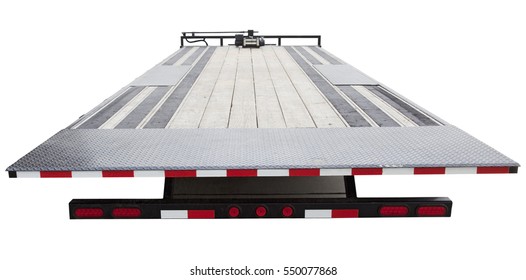 Isolated rear view of empty flatbed tow truck trailer. Horizontal.