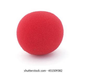 Isolated red foam clown nose on a white background.