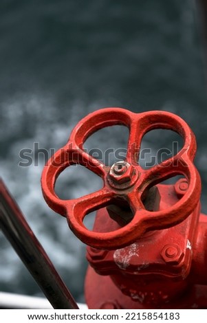isolated red valve. selective focus. close up.