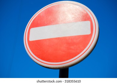 Isolated Road Side Stop Sign From The UK.  The Sky Is Blue.