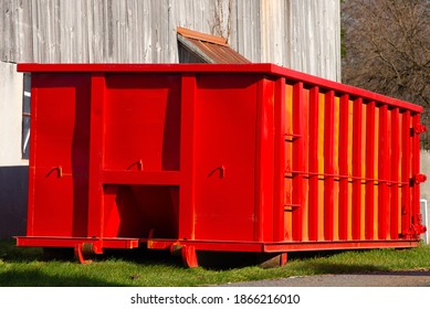 Isolated rugged red industrial dumpster garbage outdoor