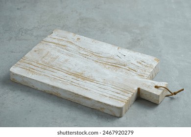 Isolated Rustic wooden cutting board or chopping board on gray background. For design and kitchen concept. Telenan - Powered by Shutterstock