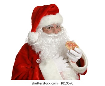 Isolated Santa Clause Eating A Christmas Cookie.