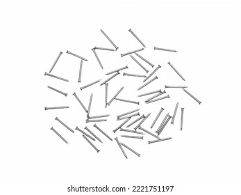 The isolated scattered metal nails over white background - Shutterstock ID 2221751197