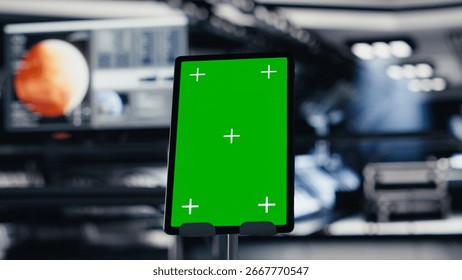 Isolated screen tablet inside spacecraft next to nearby monitor displaying Mars dashboard system telemetry. Chroma key device used for navigation to red planet during orbital mission