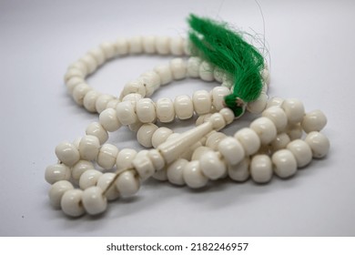 Isolated Selected Focus White Prayer Beads With Green Tassel On White Background