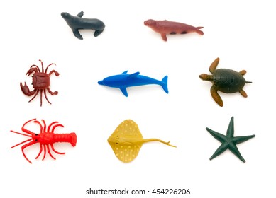 An isolated set of eight toy sea big creatures,