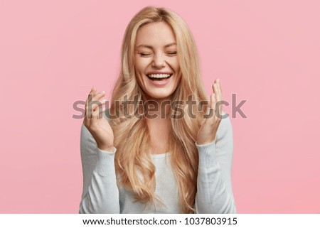 Similar – Image, Stock Photo young blonde pretty woman with orange sweater and scarf is standing at the railing outside and looks thoughtfully into the distance