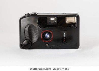 An isolated shot of an old unbranded analog camera with a 38mm lens.