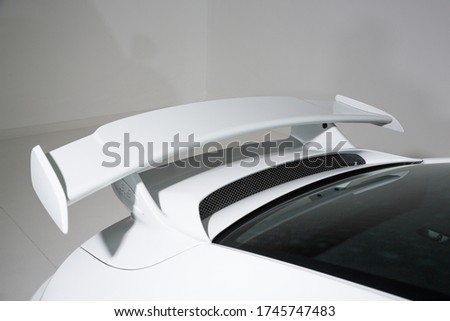 Isolated shot of rear spoiler on sports car