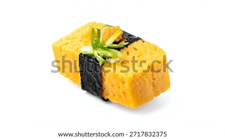 Isolated shot of a single piece of rectangular sushi with egg and garnish
