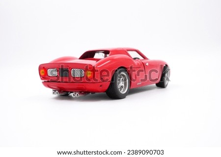 isolated simple and red sports car on white background that easily removable. back view 