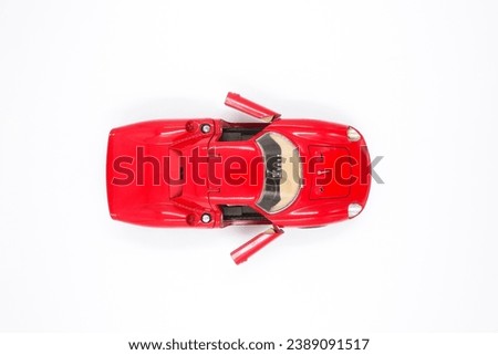 isolated simple and red sports car on white background that easily removable. top view  with the open door