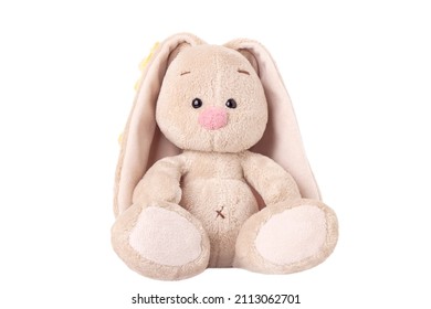 Isolated sitting toy rabbit. Plush gift. Bunny.
