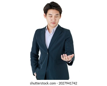 Isolated Studio Close Up Shot Of Hand Of Successful Professional Businessman Wears Black Formal Suit Stand In Front White Background Holding Blank Space For Additional Hologram Texts And Product.