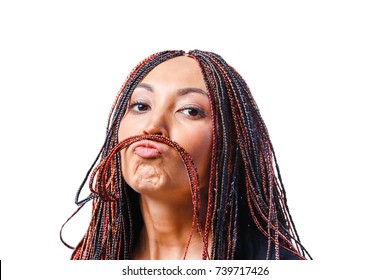 Isolated Studio Shot Of A Funny Young Woman Making Mustache With Her Dread Locks Hair