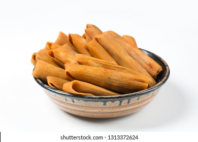 Isolated Tamales in Corn Husk