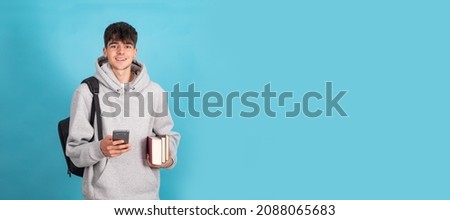 isolated teenage student with mobile phone books and backpack