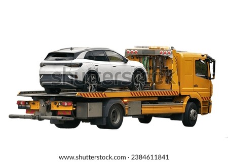 Isolated tow truck on white background. Close-up of a Tow truck with the car on the highway. Car service transportation concept. Tow truck transporting the vehicle on athe road. No background.